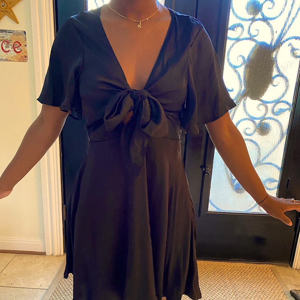 This is a Billy J black chest tie dress. Never been worn and is in good shape